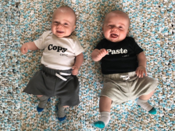 image of twin boys smiling