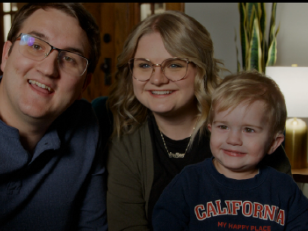 Father, mother and son smiling