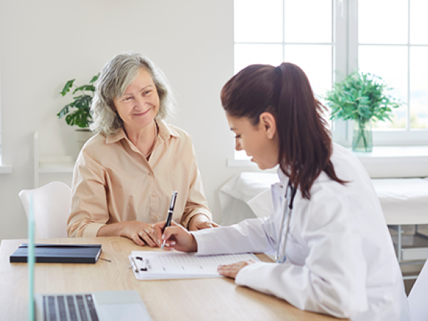Woman consulting with a health care provider