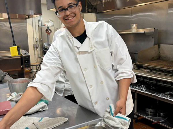 a chef presenting his dish
