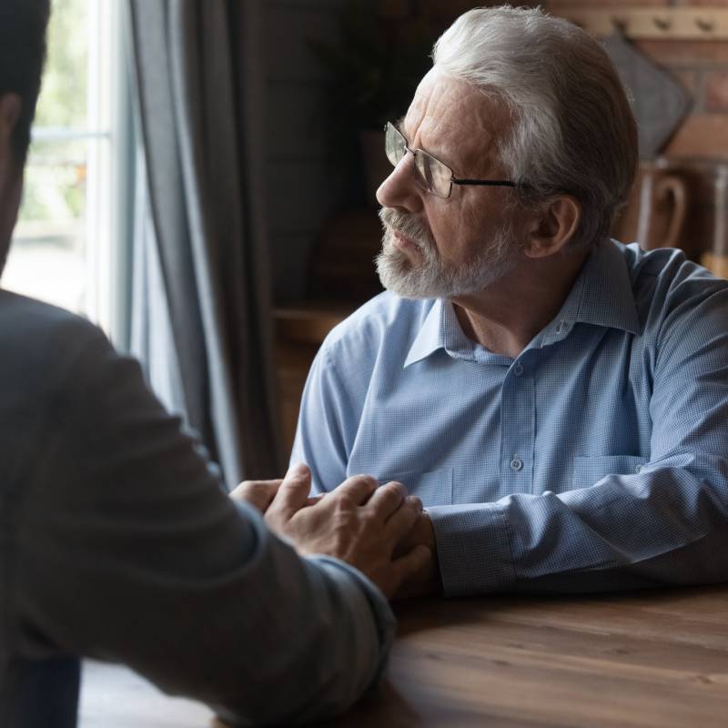 Two Men Having Conversation 