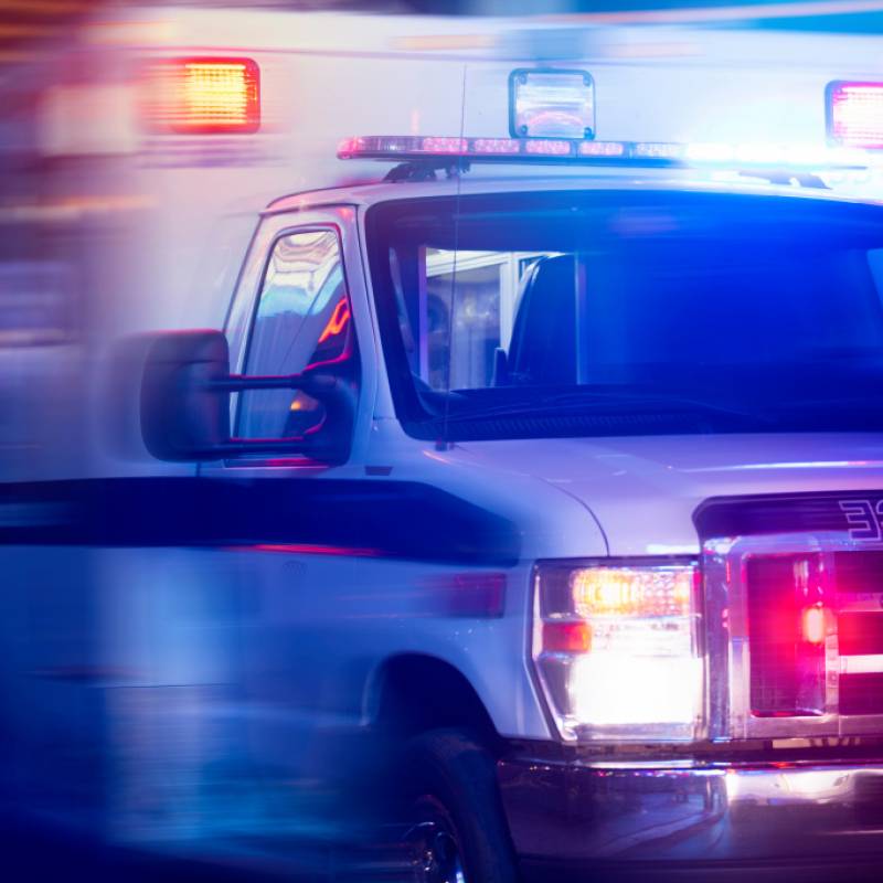 Blurred photo of ambulance with lights on