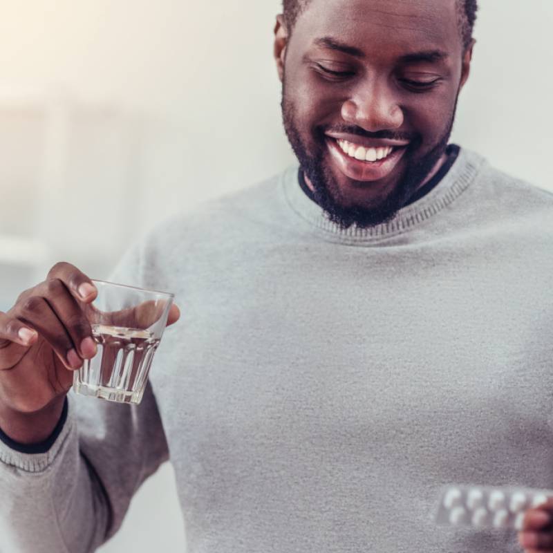 Man taking HIV oral medication 