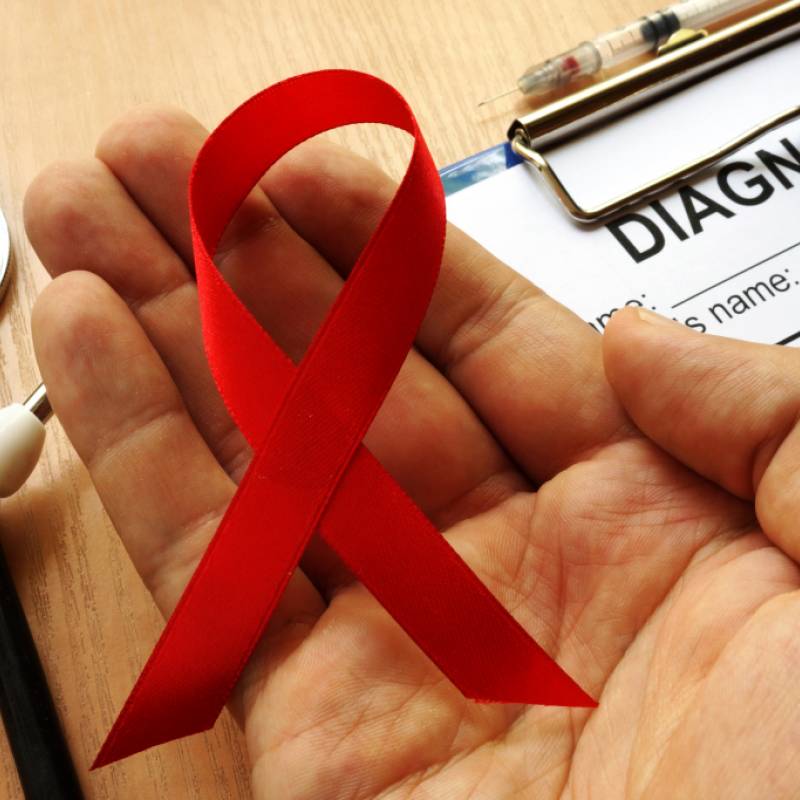 HIV Ribbon in a Providers Hand