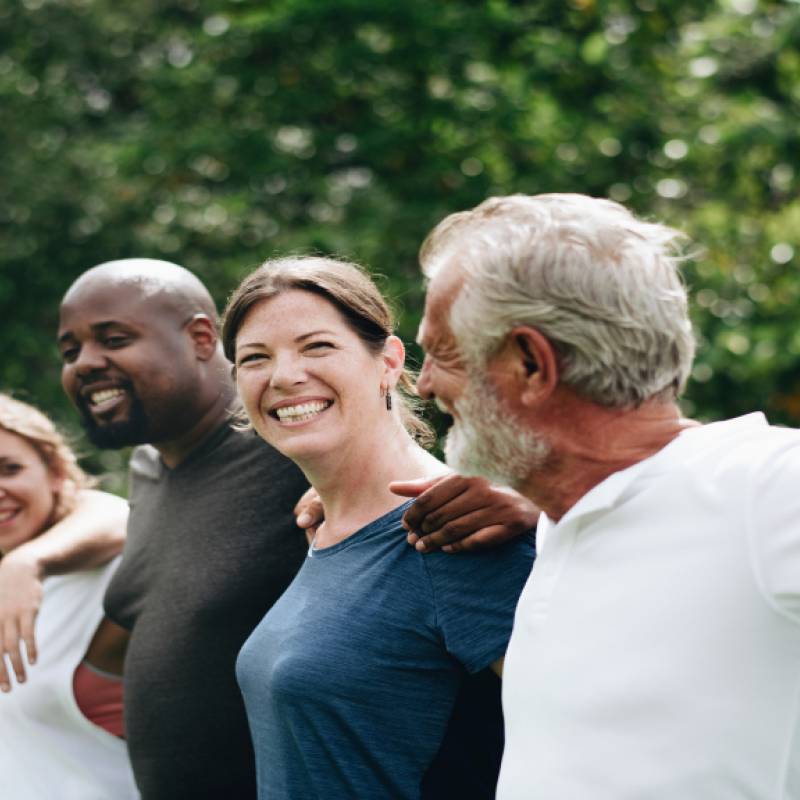 Group of people in a line linked together