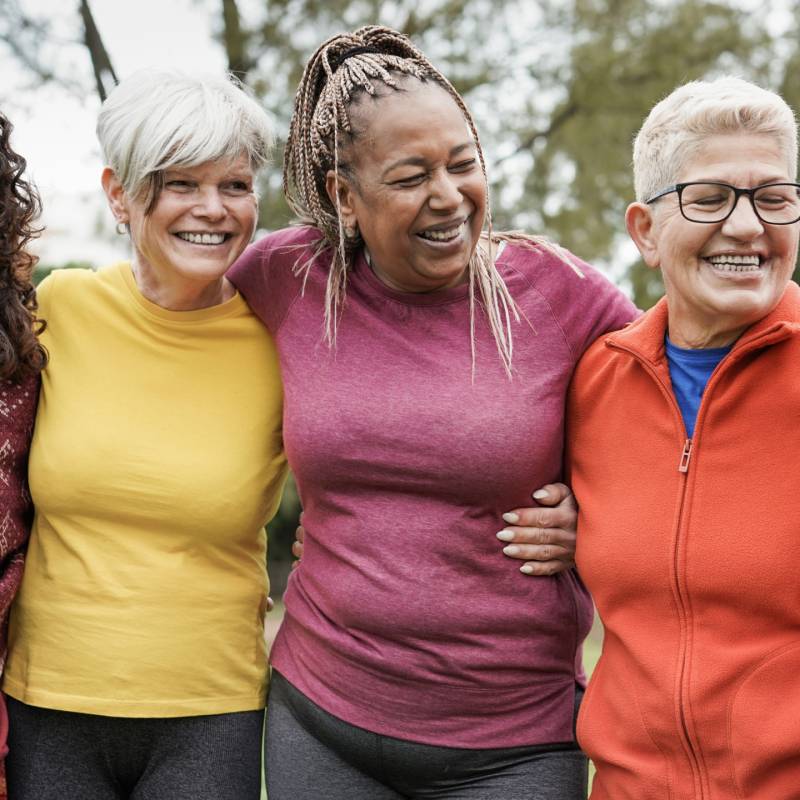 Women standing together smiling