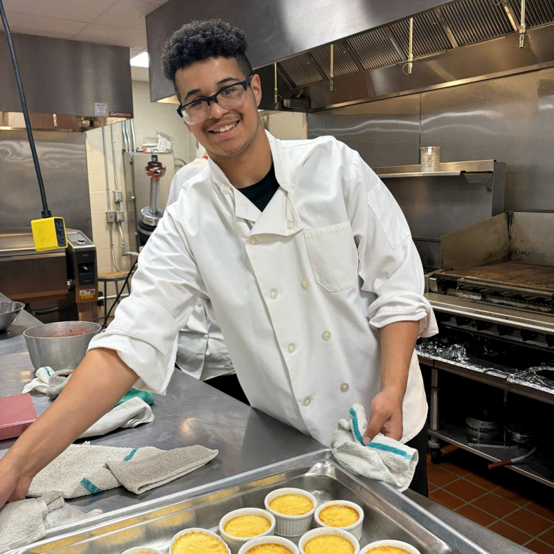 a chef presenting his dish