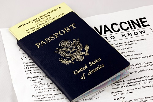 U.S. passport atop vaccine paperwork
