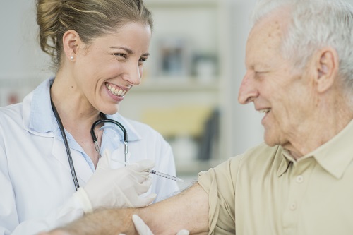Older adult male receiving vaccine