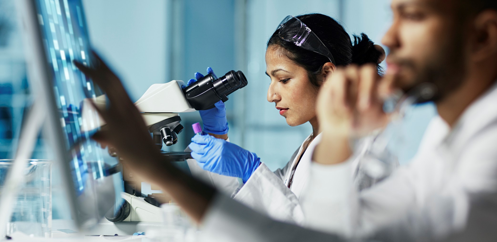 Scientist working on computer in modern lab