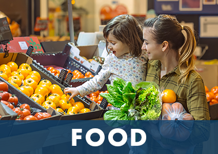 Mother and daughter shopping for produce