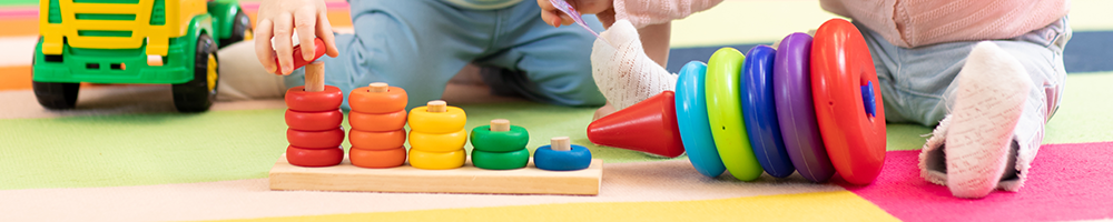 toddlers at daycare playing with toys