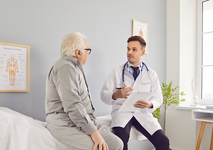 older man speaking with his doctor