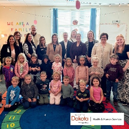 North Dakota  state leaders with a group of children