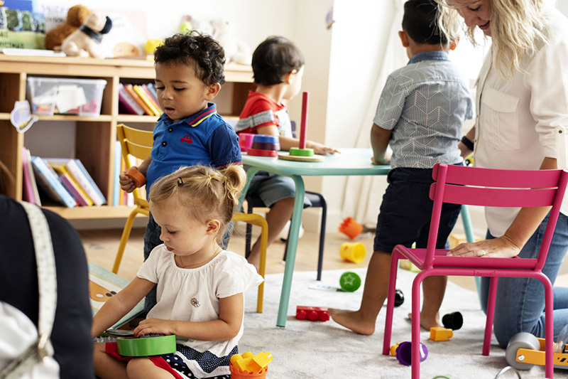 Young children playing in an early childhood education facility