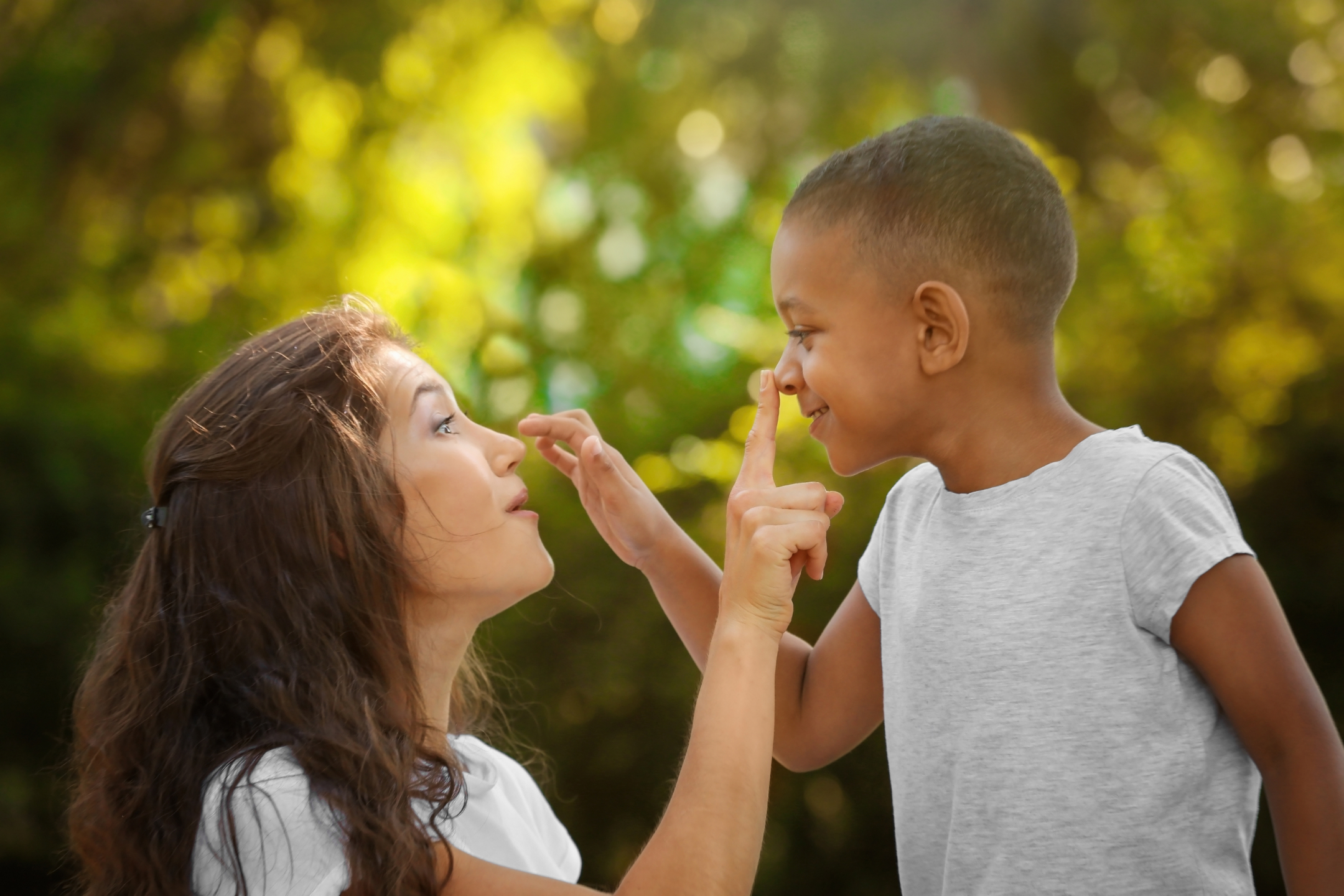 a child plays with a parent outside