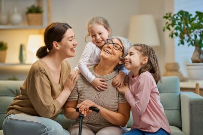 Older woman with young woman and children