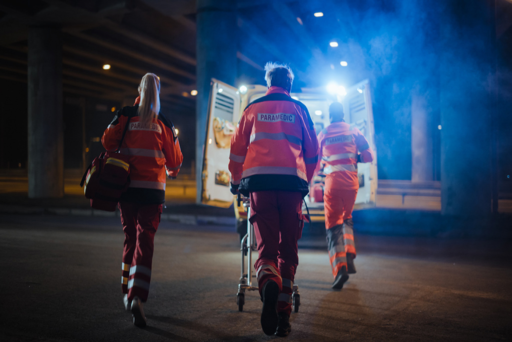 EMTs approach an ambulance