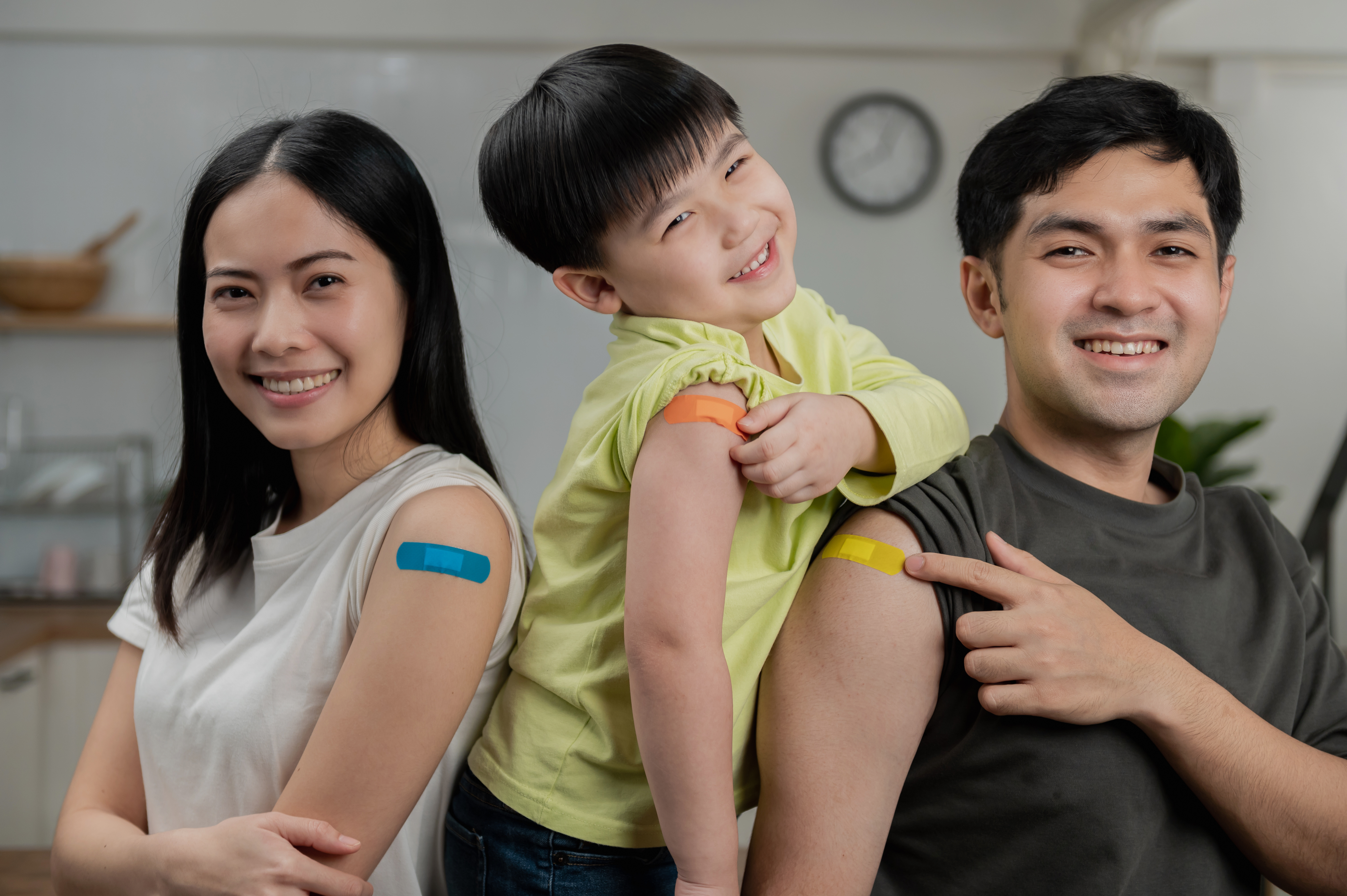 Family with bandages after receiving immunizations.