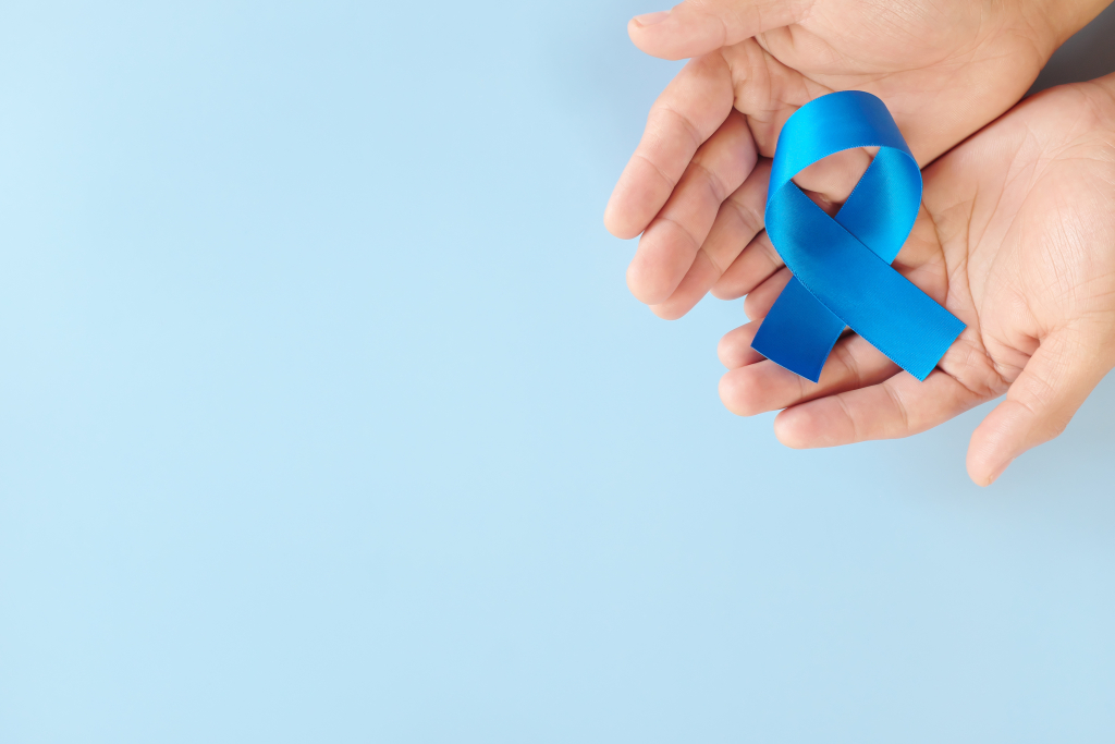 hands holding a blue ribbon 