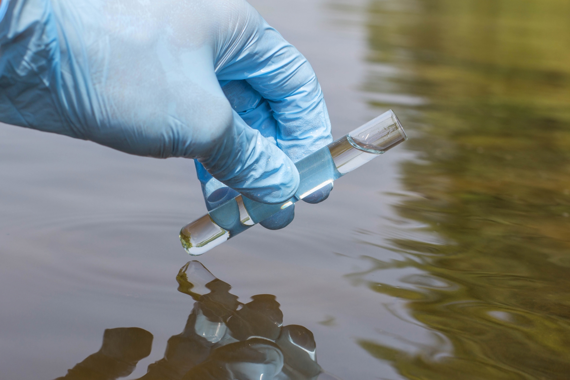 Taking a water sample for testing