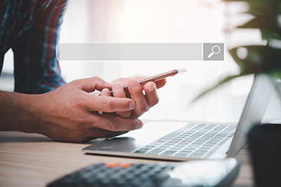 Hand man using smart phone for Searching Browsing