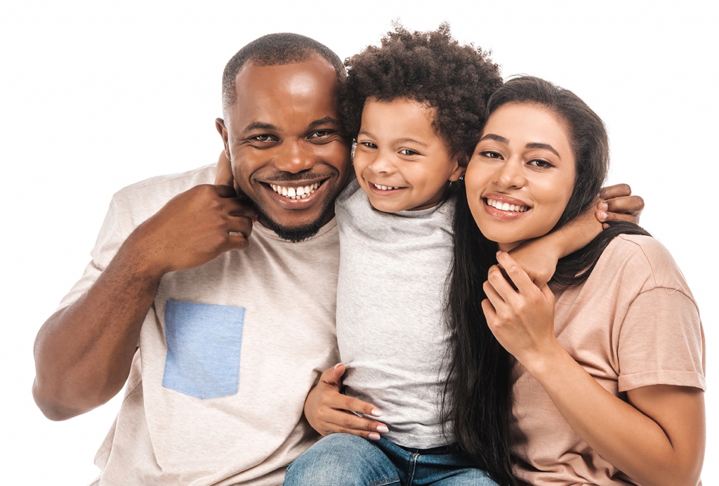 Parents and child hugging