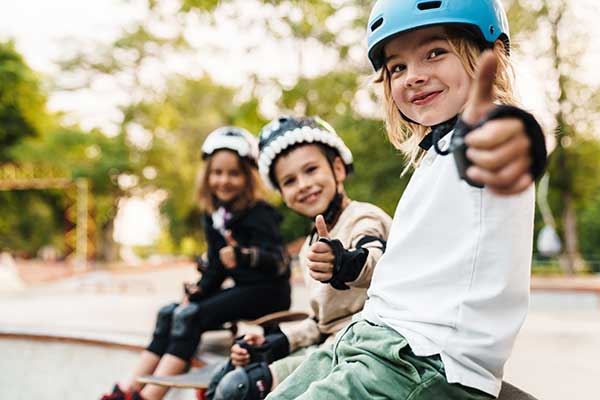 Group of kids giving thumbs up