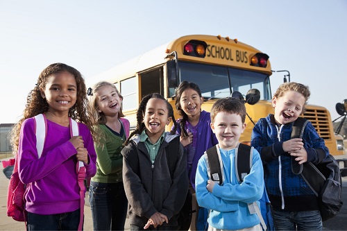 Kids in front of school bus