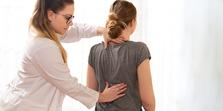 Chiropractor providing service to patient