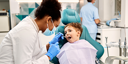 dentist examining a child's mouth