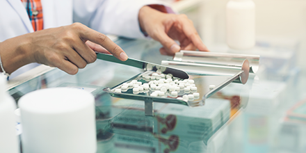 pharmacist sorting pills