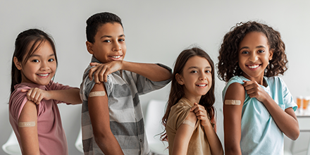 Children showing their bandages.