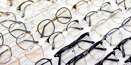 An image of a multiple pairs of eyeglasses.