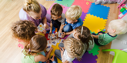 Children playing on the ground in a circle