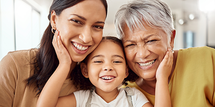 Three generations of ladies smiling