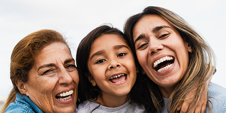 Three generations of ladies smiling