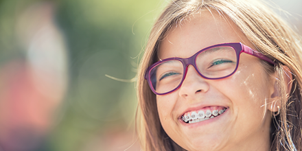 Smiling girl with braces