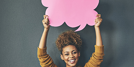 Woman holding up a sign