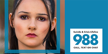 A young woman with a straight look, on a card that reads, "Suicide & crisis lifeline. 988. Call, text or chat.