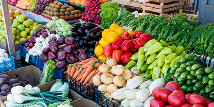 A table with colorful produce on display.