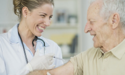 Older adult male receiving vaccine