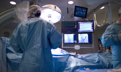 Surgeons work in an operating room