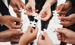 Hands, puzzle and business people collaboration, teamwork and integration closeup for planning. Team, hand and synergy with problem solving, partnership and people connecting to support innovation