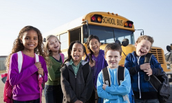 Kids in front of school bus