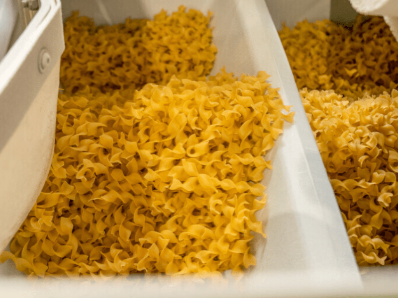 Pasta being manufactured/processed within a factory