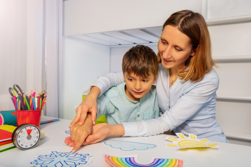 Young child learning with teacher