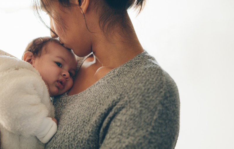 mother holding newborn baby