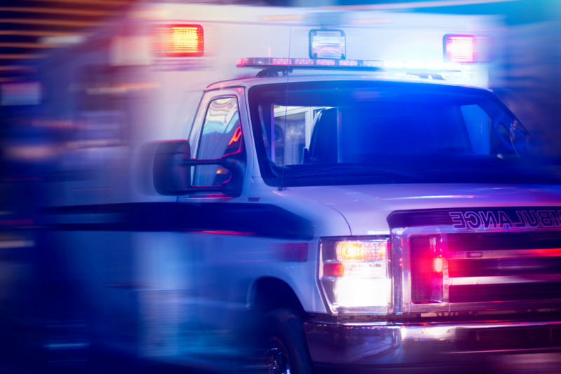 blurred photo of ambulance with lights on
