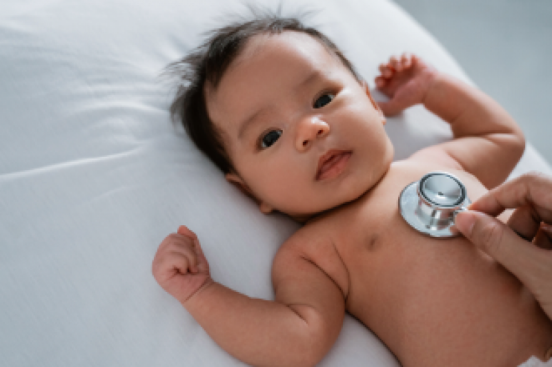Baby on bed with stethoscope